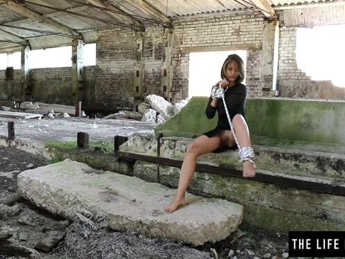 A bombshell girl tied up in a warehouse & cumming hard