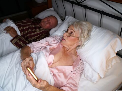 70+ old woman fucking much younger dick while her hubby is sleeping!