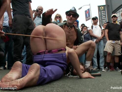 Big Breasted slave caned on the street