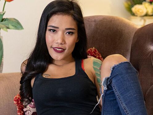 Tatted thai babe Nalin is giving a thorough blowjob