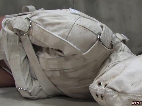 Brunette psycho bound in straitjacket