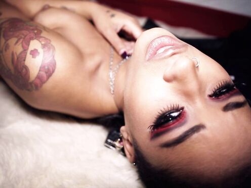 The queen of the night is covered in leather like Venus in furs