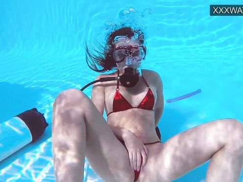 Lana Tanga toys herself underwater