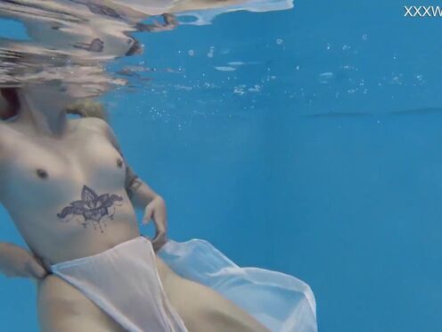 Finnish sexy girl swims nude in the pool