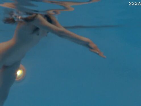 Petite Russian Marfa swims nude in the pool