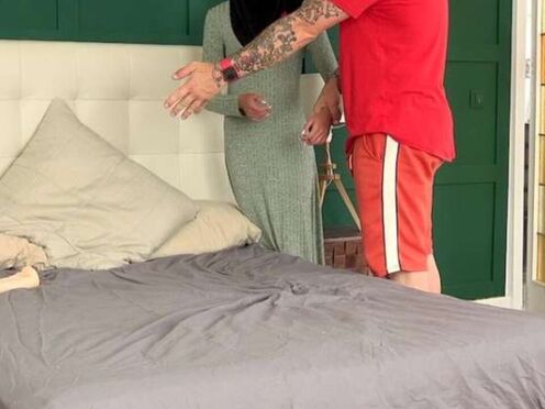 A female in hijab needs to use both holes