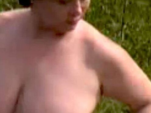 A sexy fatty masturbates outdoors