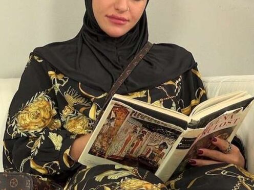 Sweet female in hijab tried on salesman's meat instead of new clothes