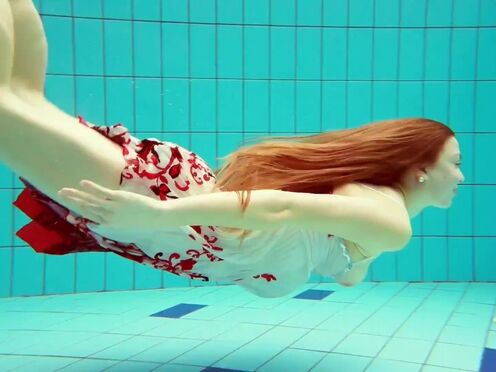 Unshaved brunette teen Marketa underwater swimming