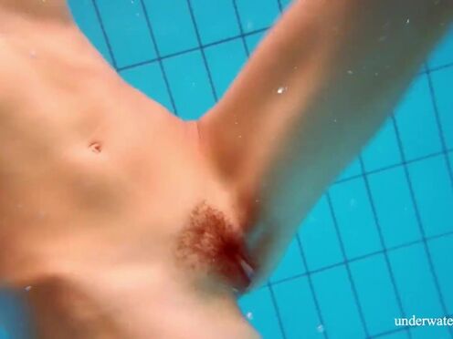 Marusia shows you her unshaved sweet vagina in the pool
