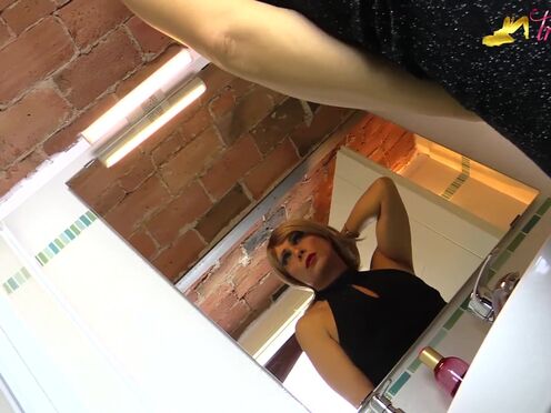 Blonde tgirl in black stockings peeing on her own feet