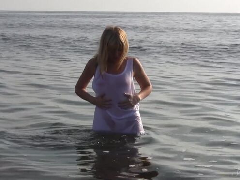 Divine Blonde Teen Blissfully Naked in the Sea