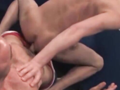 Over on the wrestling mat, RSS exclusive Taurus, in a tight blue singlet, & Ju