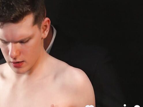 Ethan Tate fulfills his master's horny desire in the darkroom