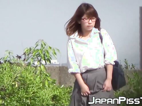 Japanese lady finds a secluded place to pee in public space