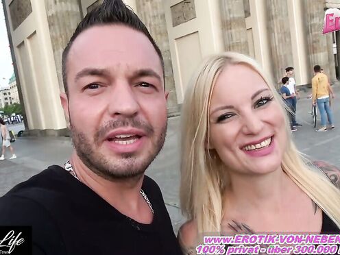 Bold Lovers Engage in Risky Public Passion at the Brandenburg Gate