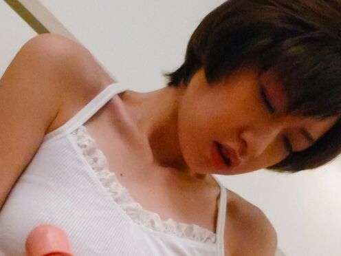 Short-haired Japanese woman Akina Hara tests her new realistic dildo