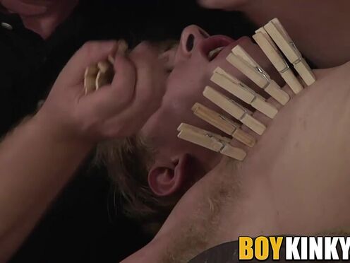 Master punishing his young sub with dozens of clothespins