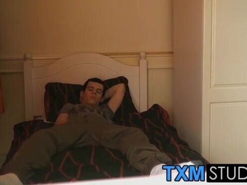 The handsome twink is relaxing on the bed & wanking off